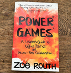 The book cover of 'Power Games: A Leader's Guide to Office Politics and Drama-Free Collaboration' by Zoë Routh, featuring a vibrant orange and red watercolor background with black text, photographed flat on a wooden surface.